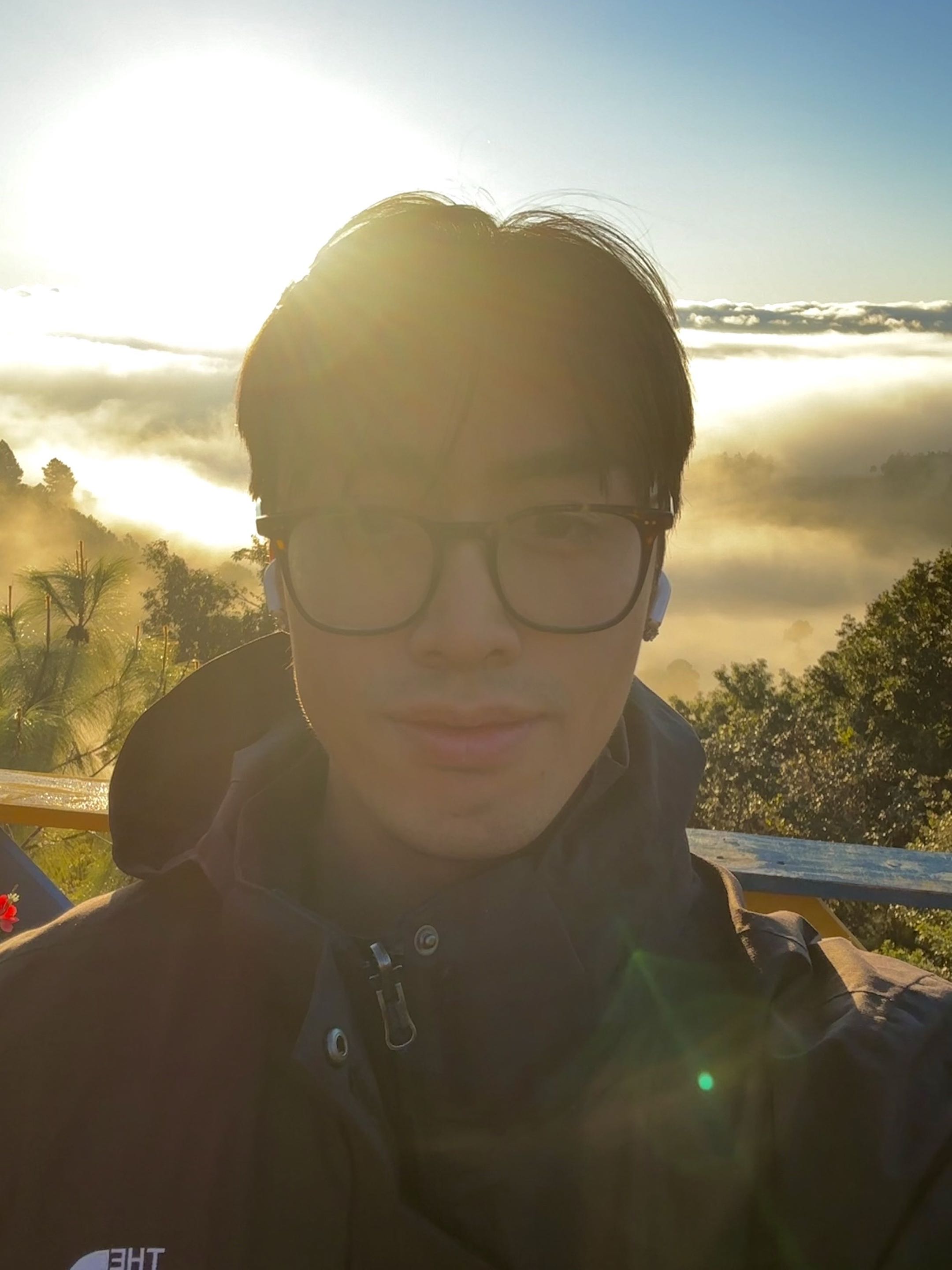 Steven Dang overlooking a mountain landscape